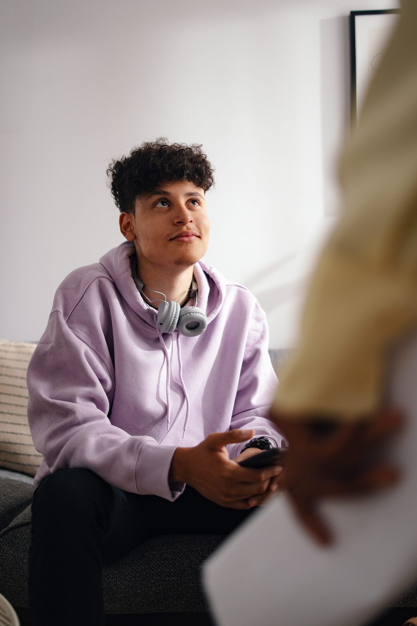 Male College Student Meeting With Campus Counselor Discussing Mental Health Issues